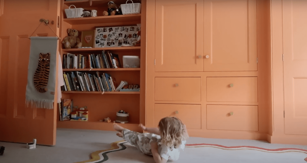A detailed view of Zoe Sugg’s home interior, showcasing her daughters’ thoughtfully designed bedroom with soft color palettes and elegant decor pieces.