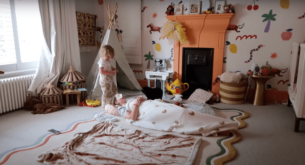 Cozy reading nook featuring a whimsical tent, soft cushions, and a beautifully arranged book corner, creating an inviting space for kids to relax and explore their imagination.