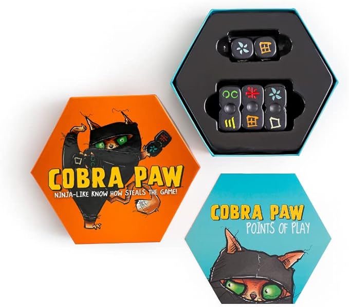 Cobra Paw game box and dice pieces displayed for gameplay.