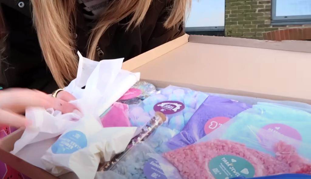 A close-up of the opened Princess Potion Kit showing colorful sensory ingredients.