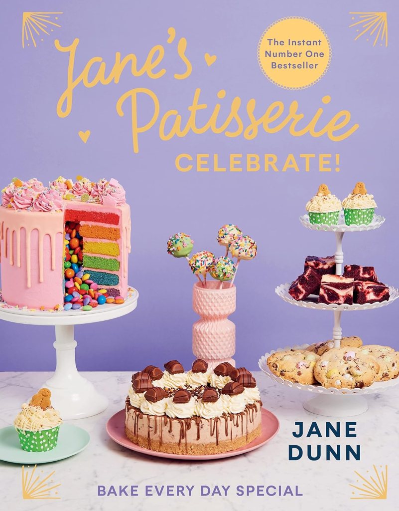 Cover of Jane’s Patisserie Celebrate! by Jane Dunn, featuring a variety of fun and festive cakes.
Caption: Jane’s Patisserie Cele