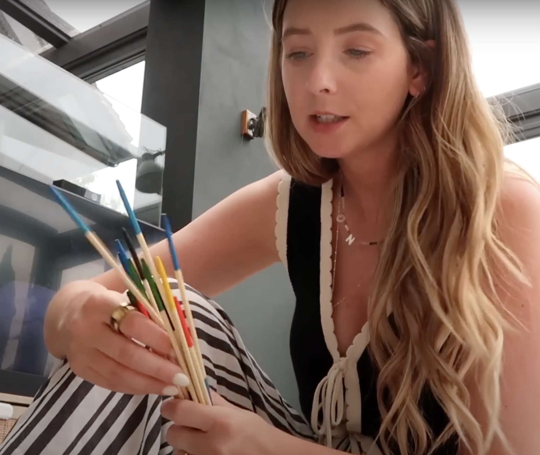 Zoe Sugg and daughter Ottie playing Wooden Pick-Up Sticks together at home.