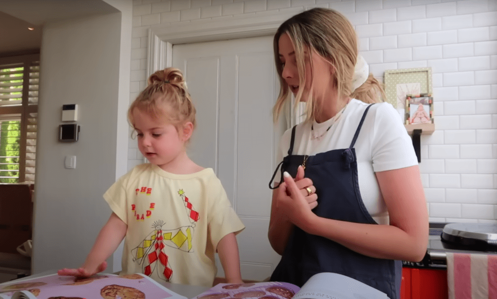 Ottilie looking at the Jane’s Patisserie cookbook for cookie inspiration.