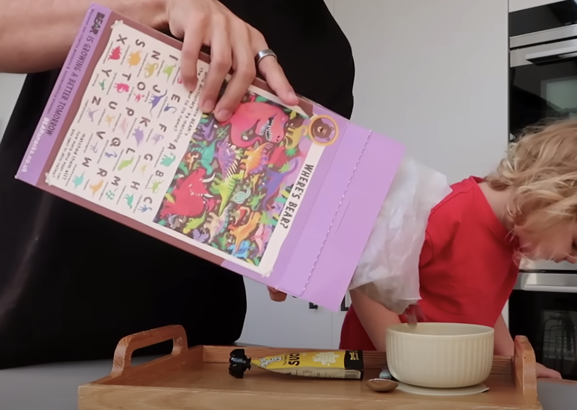 Zoe Sugg pouring BEAR Cocoa Alpha Bites cereal for Ottilie's breakfast.